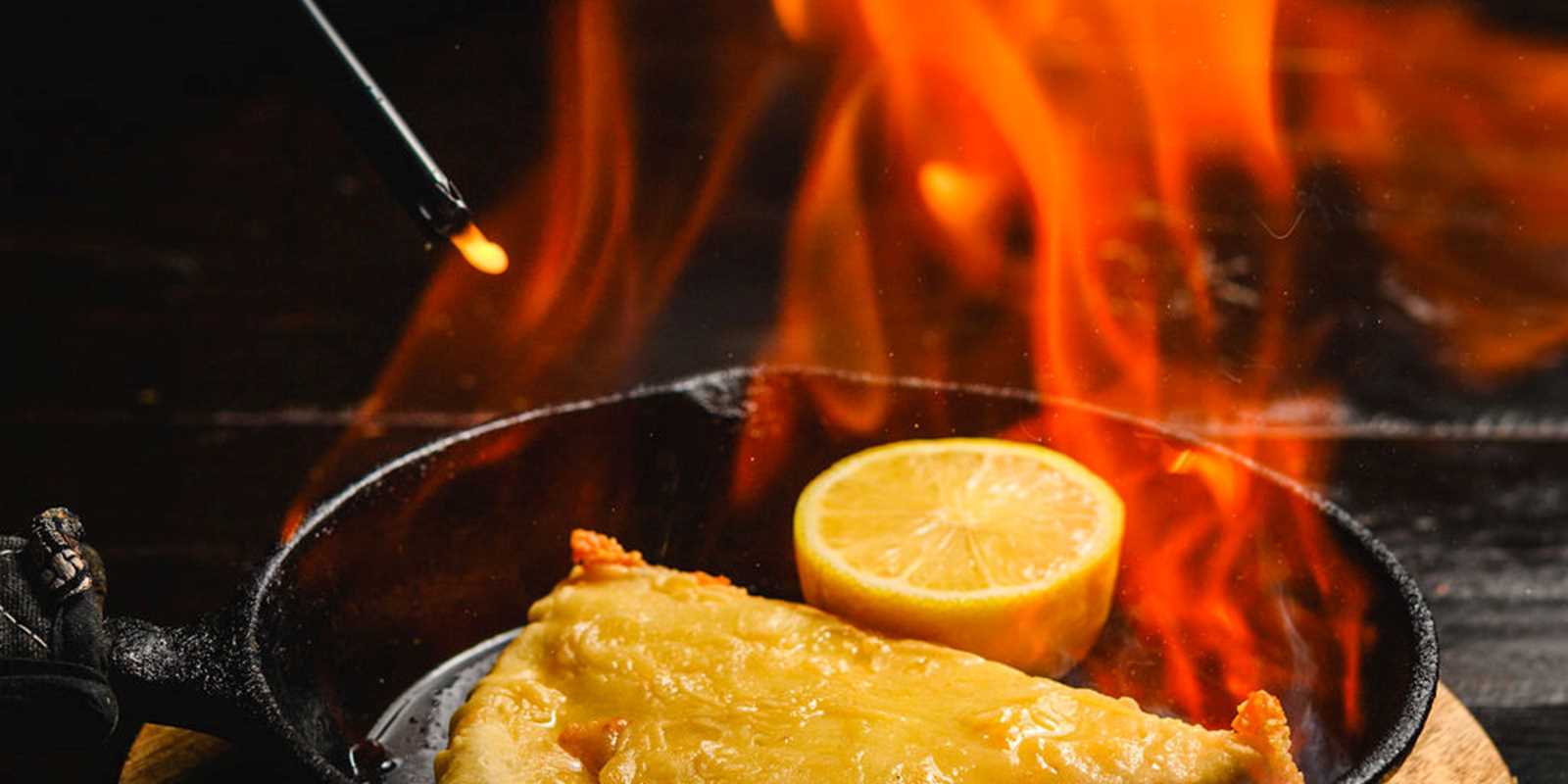 Saganaki: Kefalograviera cheese, tempura battered and gently fried. Served flambe.